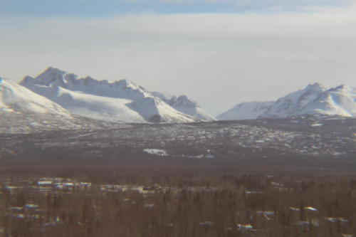 Chugach mountain range looking east from BP building on chilly and clear day.